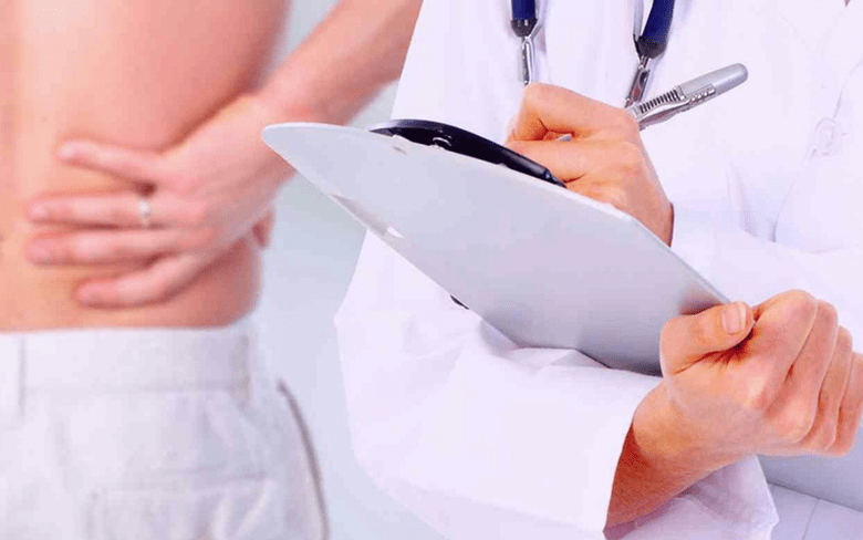 the doctor prescribes treatment for pain in the lower back